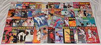 Photo showing an array of 37 vintage Black Belt martial arts magazines laid out on a white sheet. Covers feature martial arts icons and athletes in colorful action shots from the 1970s to 1990s.