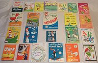 Photo showing 20 Dr. Seuss hardcover books with colorful covers and varied titles such as The Cat in the Hat, Fox in Socks, Horton, Green Eggs and Ham, The Lorax and others.