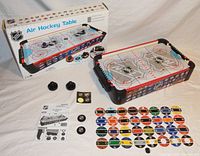 Full set including game, box, manual, additional parts, and NHL team logo stickers.
