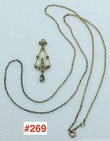 Pendant and chain overview with lot number tag