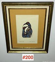 Framed art print showing the full piece with a gold frame and double matting.