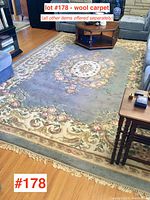 Full room view of rug laid on hardwood floor beneath coffee table and sofas.