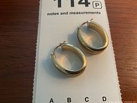 Top-down view of both hoops on notes and measurements card