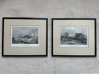 Two framed black-and-white etchings displayed side by side showing historic waterfront scenes in Toronto.