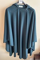 Full front view of hooded cape on hanger