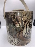 Close-up photo of the ice bucket showing leopard and tiger artwork on the surface.