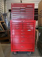 Front view of red Waterloo by Dayton tool chest showing top and bottom sections with drawers and casters