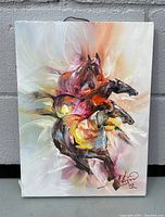 Frontal view of the signed oil on canvas painting showing the four horses in abstract style with the artist's signature visible