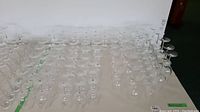 Wide view of multiple rows of Baccarat stemware on table