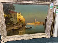 Full front view of oil painting in ornate gilt wood frame