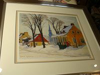 Full view of framed Clarence Gagnon print showing winter village scene