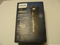 Box of Philips Shaver 5000 Series with product image and key features on front.