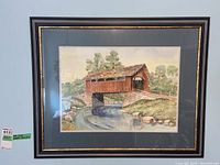 Full view of the framed watercolour painting showing the covered bridge scene with double matting and colored wood frame.