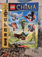 Front cover of 2013 LEGO Legends of Chima Official Guide showing the colorful characters and sealed minifigure build slots on spine.