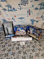 Front view showing Star Wars Stormtrooper Nutcracker in box, telescope, and Star Wars model kits