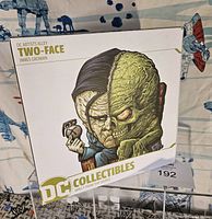 Box front showing Two-Face illustration by James Groman from DC Artists Alley