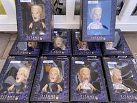 Ten Buffy the Vampire Slayer SPIKE Titans vinyl figures boxed together showing front-facing views inside packaging with purple and black design.