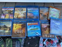 Photo showing nine sealed IMAX BluRay movies arranged in two rows with visible titles and artwork showcasing various natural and adventure scenes.
