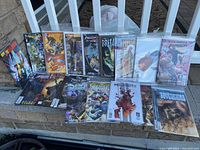 Front row and back row comic books bagged and boarded or sealed, various variant covers including Justice League, Pacific Rim, Brutal, Hellboy and others