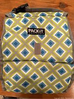 Front view of the PackIt freezable lunch bag showing diamond pattern and logo patch.
