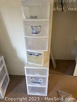 Full view of the 3 Sterlite plastic drawer carts stacked vertically, each with 3 translucent drawers and white plastic frame.