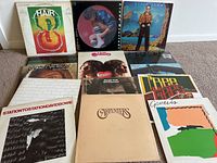 Full view of 14 vintage vinyl LP record albums featuring classic artists and original jacket art.