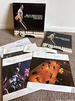 Full view of the 5 LP record set with outer box, album jackets, and inner sleeves showing concert photography and artwork.