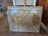 Front view of two granite slabs standing upright showing size and pattern