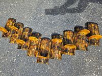 Full view of metal candle wall art showing wave pattern and all nine candle holders, painted in autumn colors.