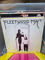 Vinyl record album cover for Fleetwood Mac self-titled album showing two men near a window, black and white.