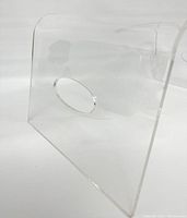Side angle view showing clear lucite acrylic material and one handle cutout.