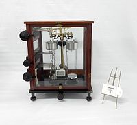 Front view of entire analytical scale in mahogany and glass case