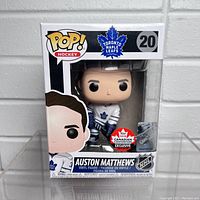 Front view of unopened Funko Pop box showing Auston Matthews figure in Toronto Maple Leafs uniform with 2018 Canadian Convention Exclusive sticker.