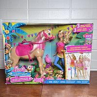 Full front view of the sealed Barbie Dancin' Fun Horse Set box from 2016 showing Barbie doll and horse inside packaging with colorful graphics.