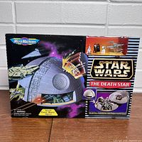 Front view of the boxed Star Wars Micro Machines Death Star playset showing artwork and play features