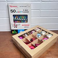 Photo of Renown 50-light 5-way flasher box and open box of assorted colorful vintage glass ornaments
