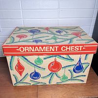 Front view of the vintage ornament chest showing colorful ornament graphics and box dimensions.