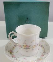 Birks porcelain cup and saucer with original green Birks box behind them