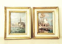 Front view showing two small framed gondola prints with distressed gold frames and Venetian scenes.