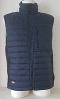 Front view of navy blue men's lightweight vest with full zipper, chest zippered pocket, and black side panels.