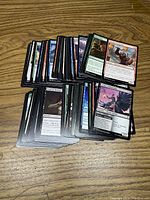 Front view of assorted Magic The Gathering cards showing various fantasy artwork and game text.