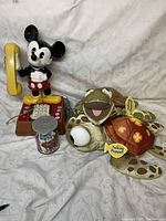Full lot showing Mickey Mouse phone, two talking hand puppets (turtle and floral), and Snow White puzzle container