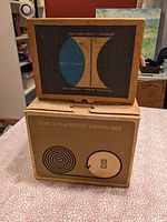 Box set photograph showing the smaller box with Bell & Howell branding and the larger box with Berkey Dual 8 Film Editor Model D23 labeling.