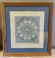 Full view of the framed print showing the artwork and frame