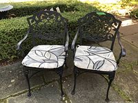 Two chairs with cushions installed, front view