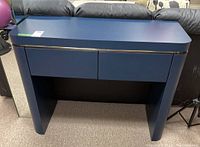 Front view of the blue sofa table with drawers closed