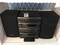 Full view of Panasonic mini stereo system with two speakers and remote