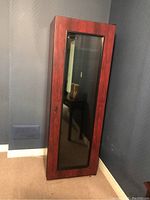 Front and side view of the tall wine cooler cabinet with wood finish and glass door, showing overall condition and size.