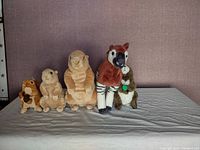 Full view of all 5 plush animals in the collection showing chipmunk, prairie dogs, okapi, and gopher