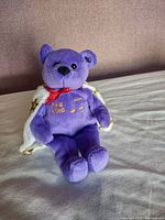 Front view of the purple Elvis Museum Beanie Bear showing embroidered details and cape.